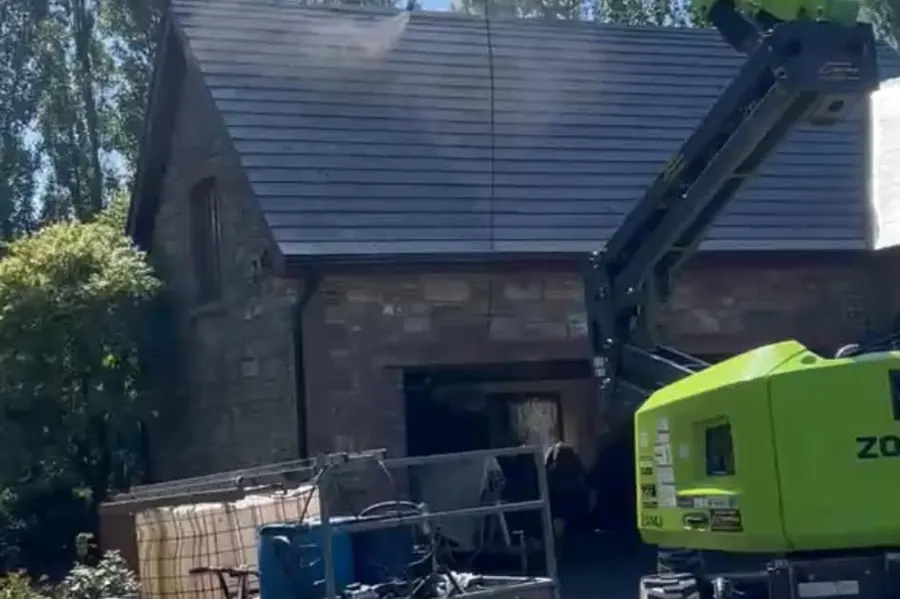Soft washing equipment and access platform set up to clean a roof in County Kilkenny