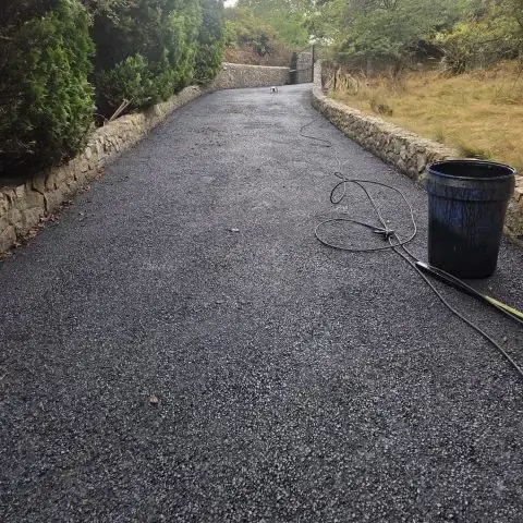Tarmac Driveway Cleaning and Moss Removal Tarmac driveway after being cleaned and all moss removed