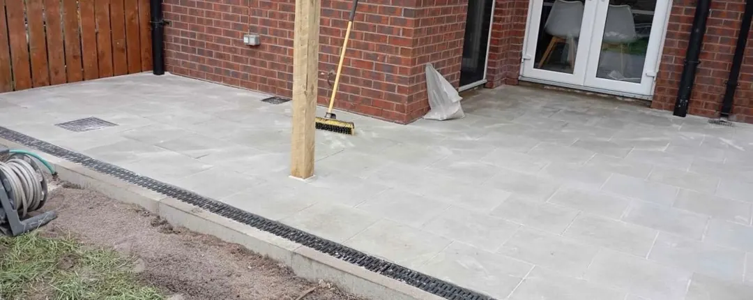 Porcelain Patio with Drainage in County Laois Porcelain patio with a linear drainage channel at a County Laois home