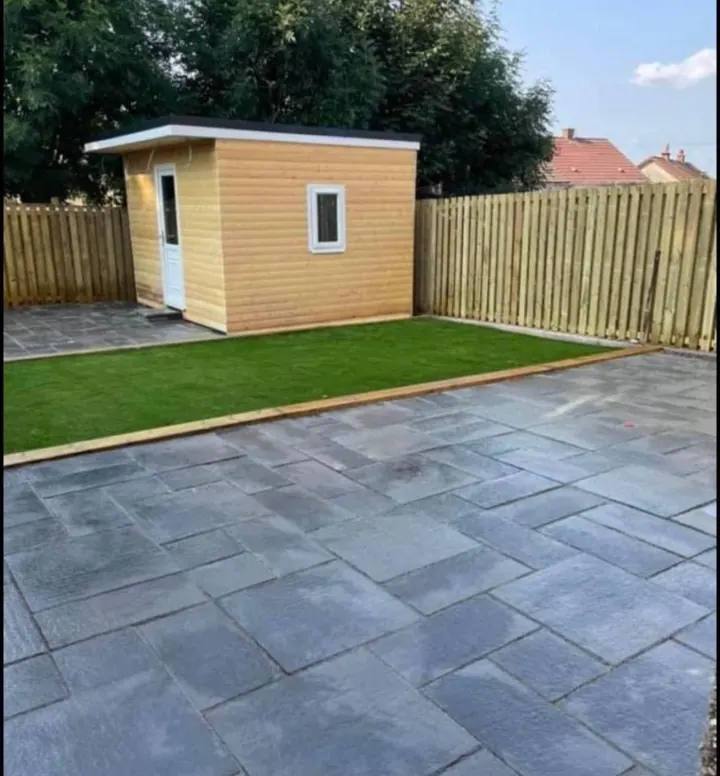 Porcelain Patio and Garden in Kilkenny City Dark porcelain patio with a garden room and lawn in a Kilkenny City back garden